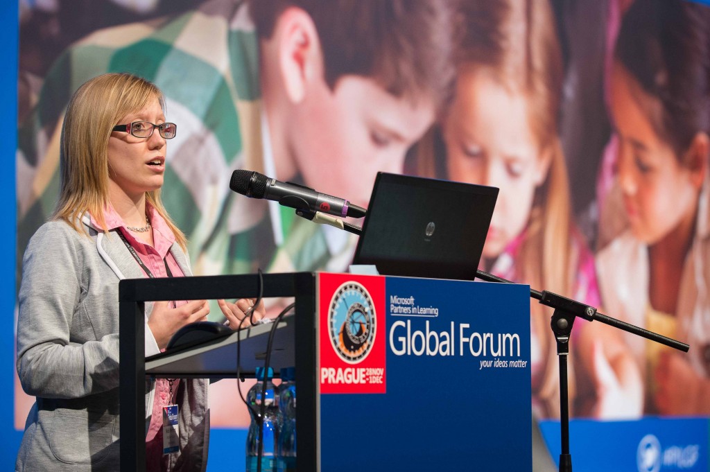 Photo of Nicki Cooper presenting at a Microsoft event in Prague.